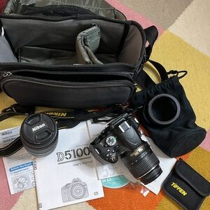 NIKON D5100 with two lenses.